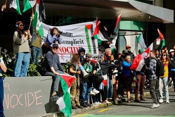 Pro-Palestinian supporters outside the TVNZ building on Hobson St in central Auckland. Photo / Dean Purcell