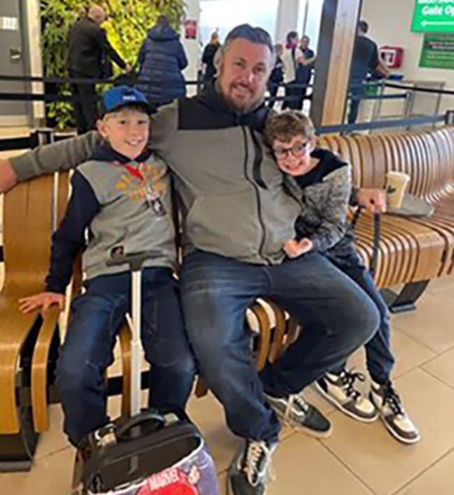 Oliver Stephenson, 11, (left) with dad Elliott Stephenson and brother Eli Stephenson at the Hobart Airport. Picture / Supplied