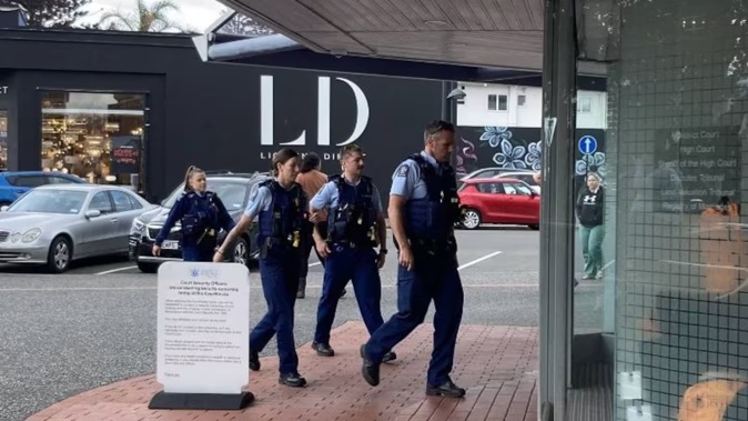 Police entering Napier courthouse after the courtroom melee on September 11 last year. Photo / Ric Stevens