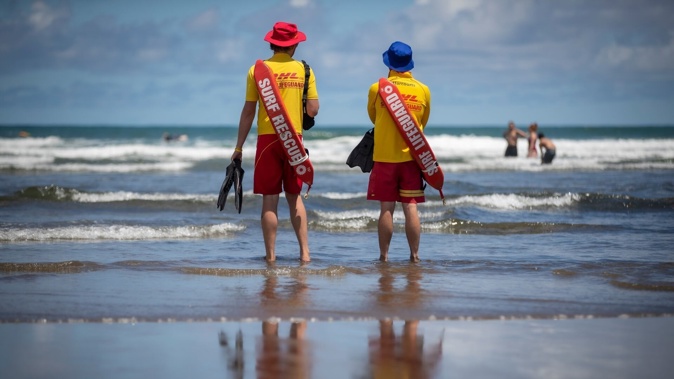 Members of Te Henga Bethells Beach Surf Life Saving Club pulled off a dramatic rescue almost 1km off the beach on Friday night. Photo/ Michael Craig