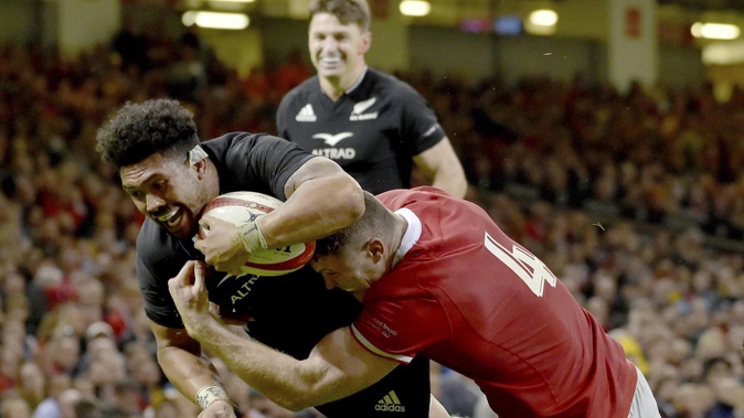 Ardie Savea scores in the tackle of a Welsh defender. Photo / AP