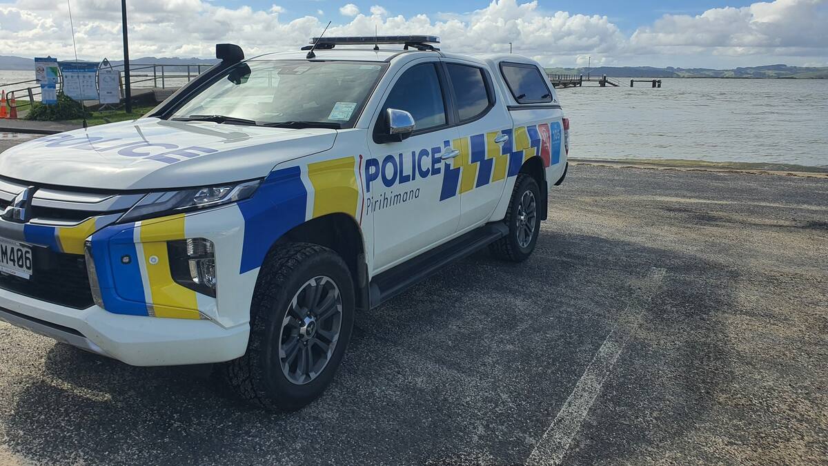 Young dad missing from north Auckland beach swept away while retrieving fishing gear