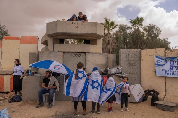 People gather at Israel's Nitzana border crossing with Egypt in southern Israel. Photo / AP