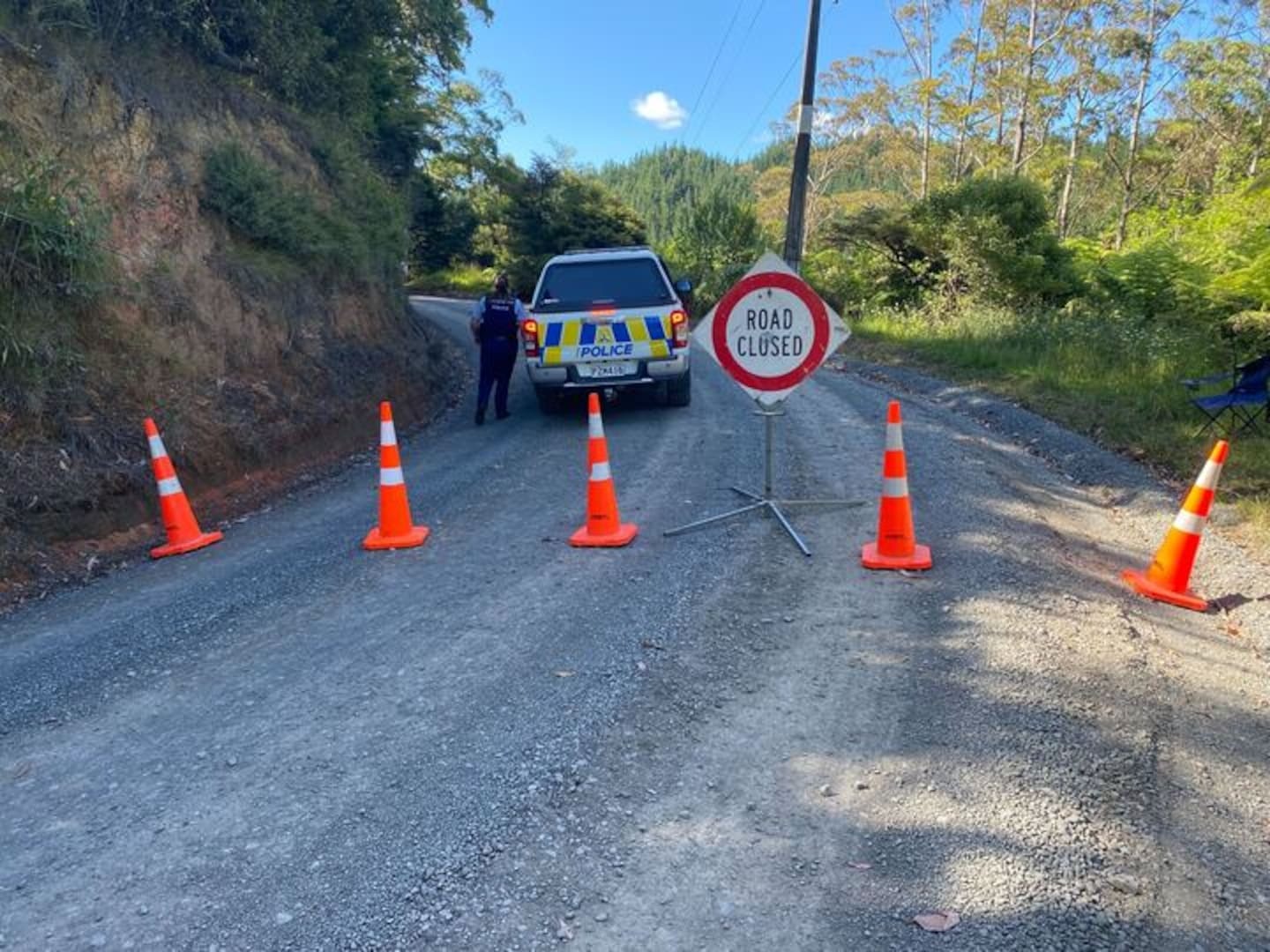 Police at a roadblock in Coromandel soon after yesterday's shooting, in which one person died and another was injured on the remote 309 Rd. Photo / Al Williams