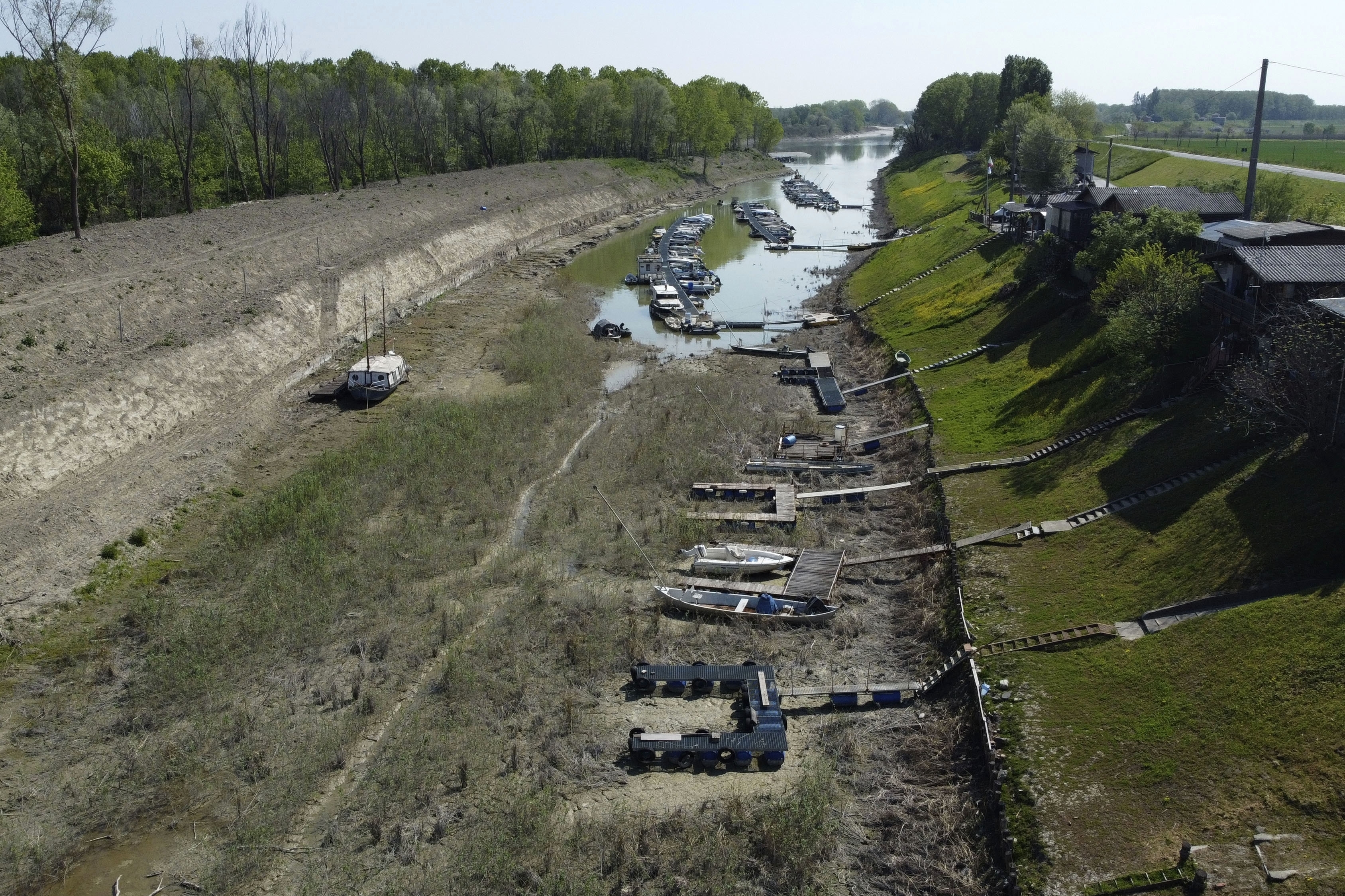 Boats lie on the dried shipyard on the Po river in Torricella, near Cremona, Italy, Wednesday, April 19, 2023. Italy's largest river is already as low as it was last summer, sparking fears of precariously dry months ahead with those who rely on it having to scramble for alternative, water-saving plans. Photo / AP