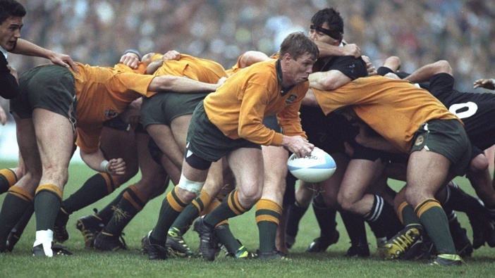 Scrum Half Nick Farr-Jones (centre) of Australia passes the ball away from the scrum in the Australia v New Zealand semi finals match during the 1991 Rugby Union World Cup at Lansdowne Road in Dublin, Ireland. Australia won the match 16-6.\ Mandatory Credit: Russell Cheyne/Allsport