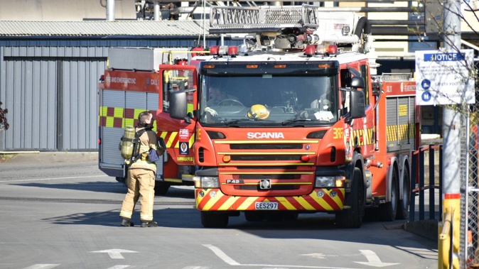 Firefighters responding to a workplace accident at a South Auckland business after a person suffered burns following a chemical spill. Photo / Darren Masters