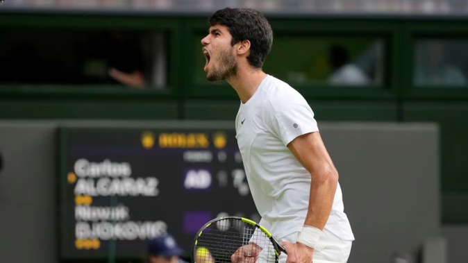 Spain's Carlos Alcaraz celebrates after winning a point against Serbia's Novak Djokovic in the final of the men's singles at Wimbledon. Photo / AP