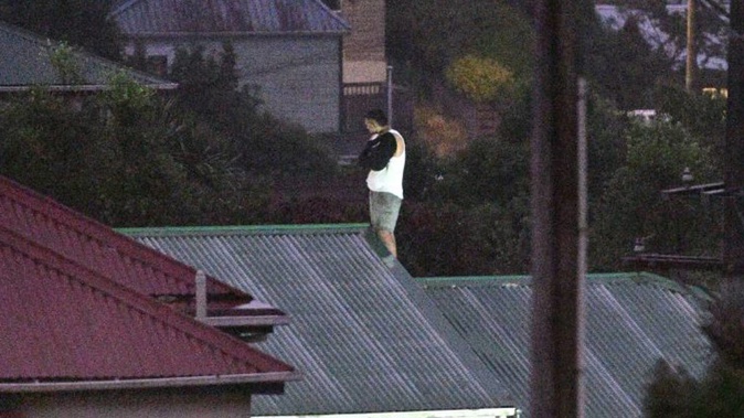 Armed police were at Neidpath Rd with the man at the centre of the siege on the roof. Photo / Stephen Jaquiery