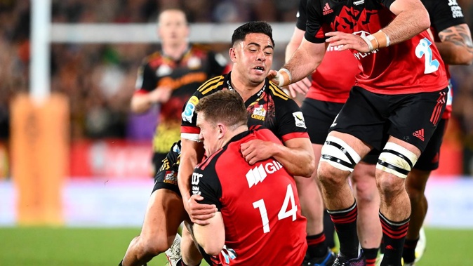 Anton Lienert-Brown of the Chiefs tackles Dallas McLeod of the Crusaders. Photo / Getty