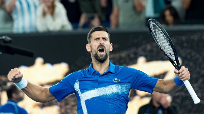 Novak Djokovic celebrates match point against Tomas Machac. Photo / Getty Images