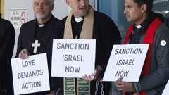 Priests protesting at Nicola Willis' office over Gaza. Photo / Ethan Manera