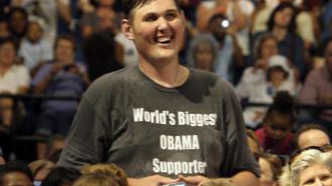 Igor Vovkovinskiy listening to Barack Obama, during a health insurance reform rally in Minneapolis. (Photo / AP)