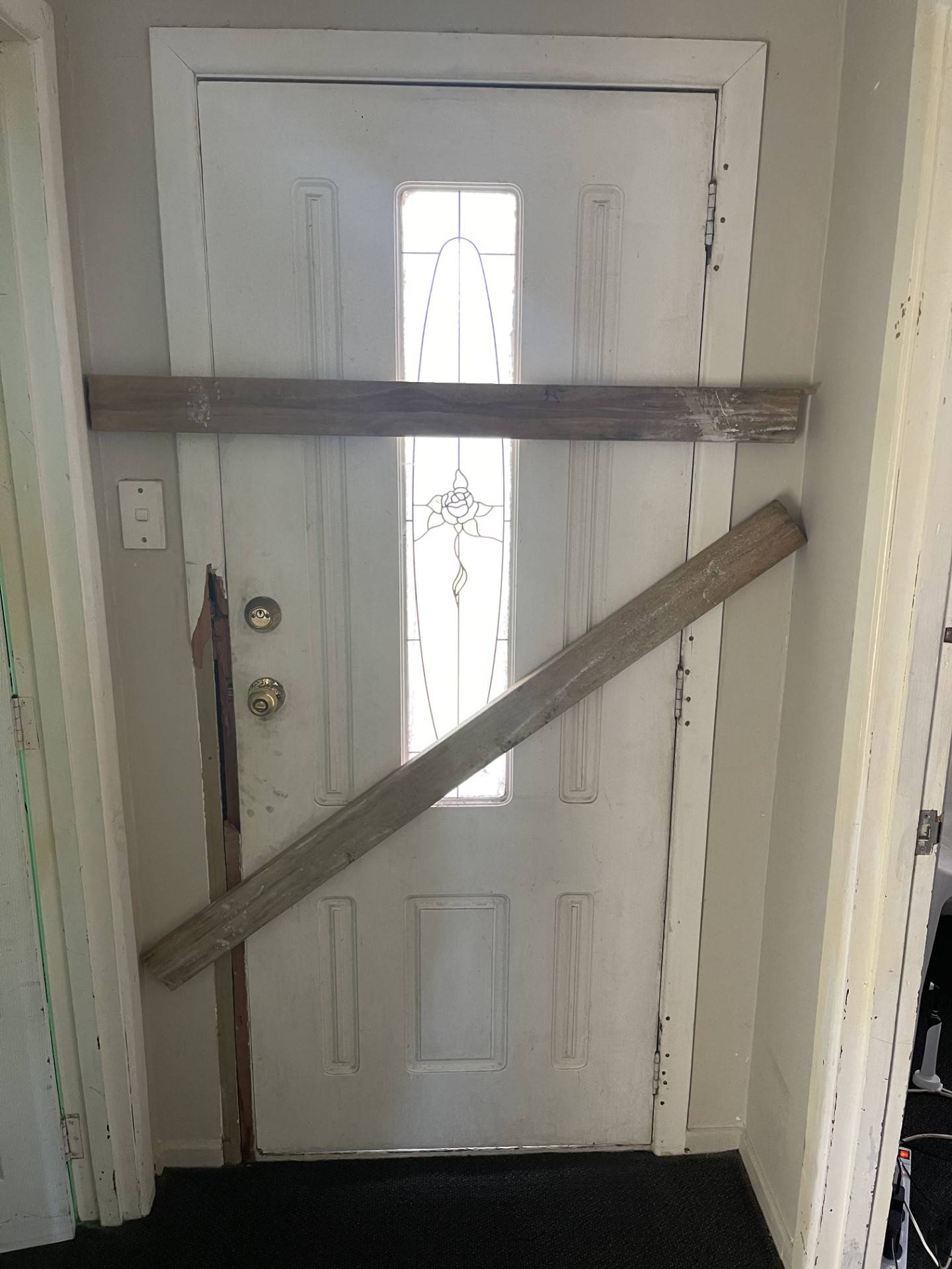 The front door was kicked in for access to the Kelston home. Photo / Supplied