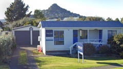 A garage and police car have been destroyed after a suspicious fire at Tairua Police Station in Coromandel Peninsula early this morning. Photo / Google Street View