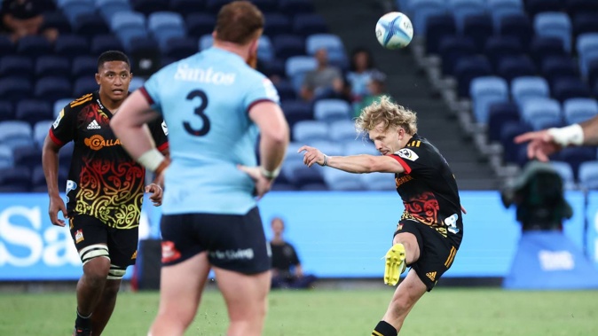 Damian McKenzie (right) from the Chiefs kicks a penalty goal during the Super Rugby Pacific Round 5 match against the Waratahs. Photo / David Gray, Photosport