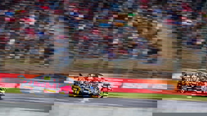 Craig Lowndes races along the main straight during the Supercars race at Pukekohe Park in 2014.