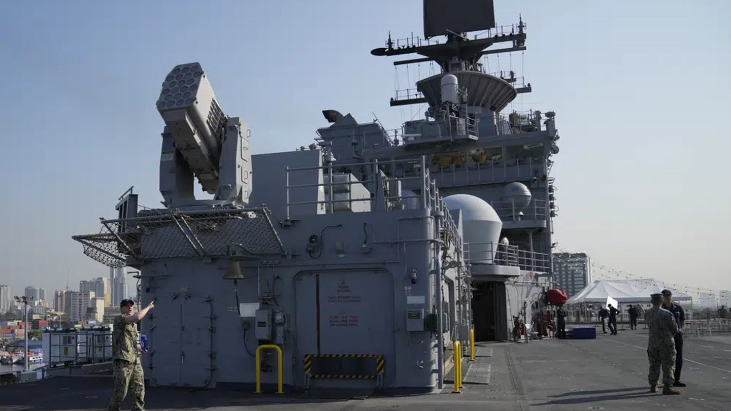 A US Marines personnel gestures at the flight deck of the USS America during a scheduled port visit in Manila, Philippines. Photo / AP