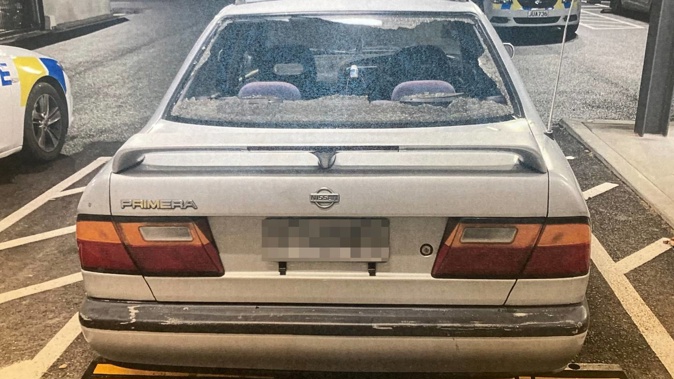 One of the shots fired by Gino Butler smashed the rear window of an innocent driver's car and passed through the sun visor before exiting just above the windscreen. Photo / NZ Police