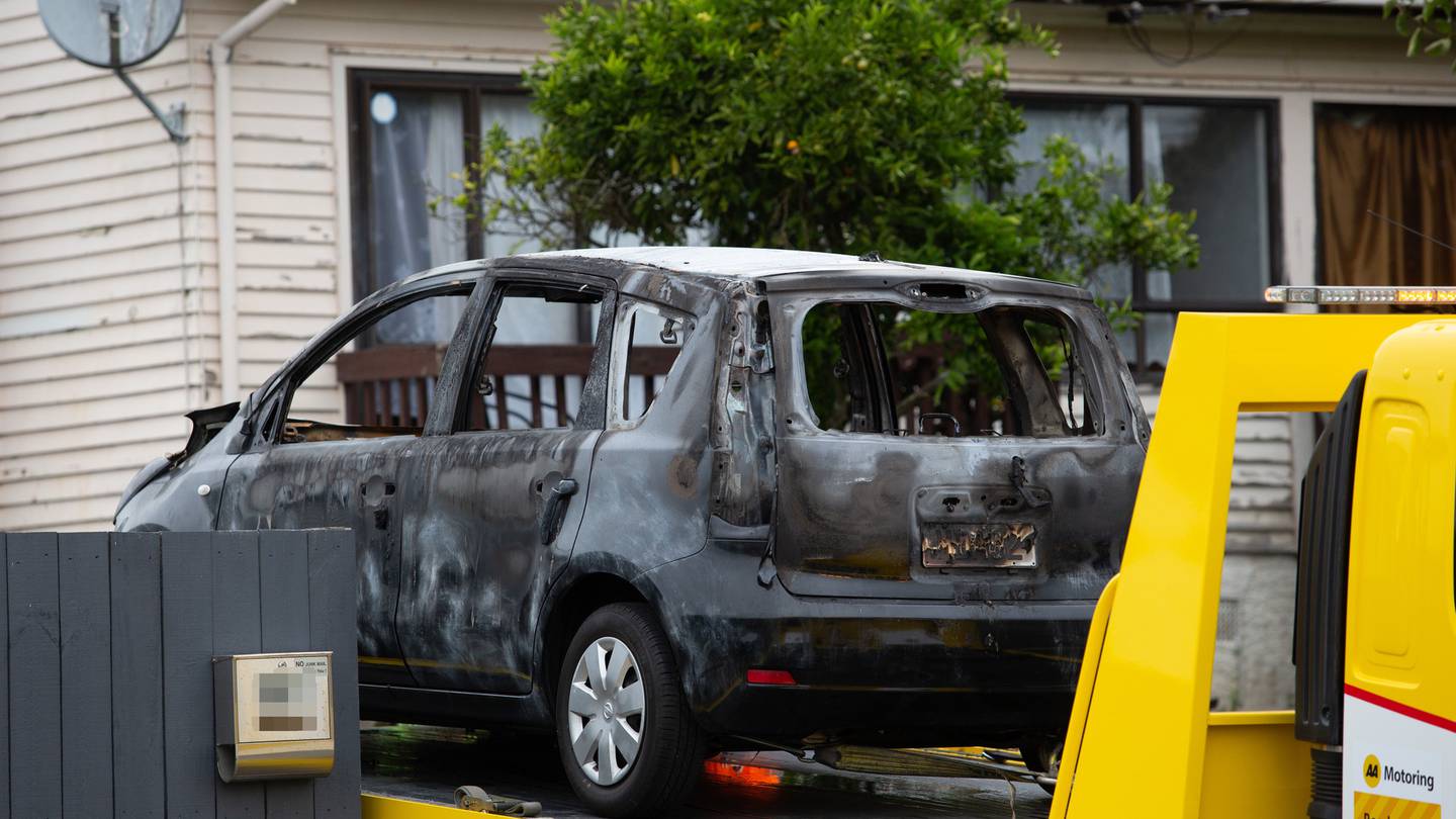 The shell of the burnt-out car at the Mt Roskill property where Tania Hadley was killed. Photo / Sylvie Whinray
