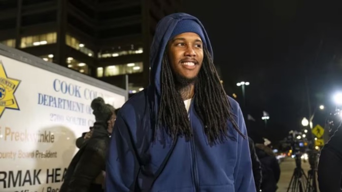 Darien Harris walks toward his wife’s vehicle outside Cook County Jail. Photo / AP