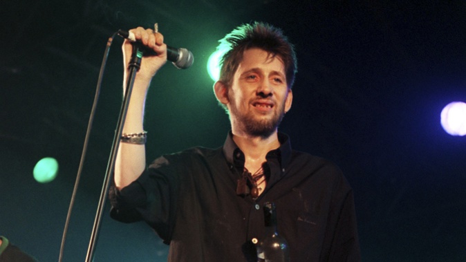 Former Pogues member Shane MacGowan onstage with his group The Popes in North London in July, 1999.  Macgowan has died at the age of 65. Photo / AP