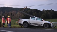 Top Energy line workers at the crash scene just north of Puketona Junction. Photo / Peter de Graaf