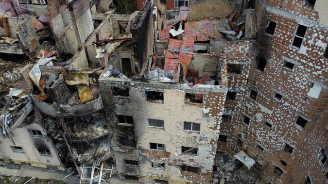 Damaged buildings ruined by attacks are seen in Irpin, on the outskirts Kyiv. Photo / AP