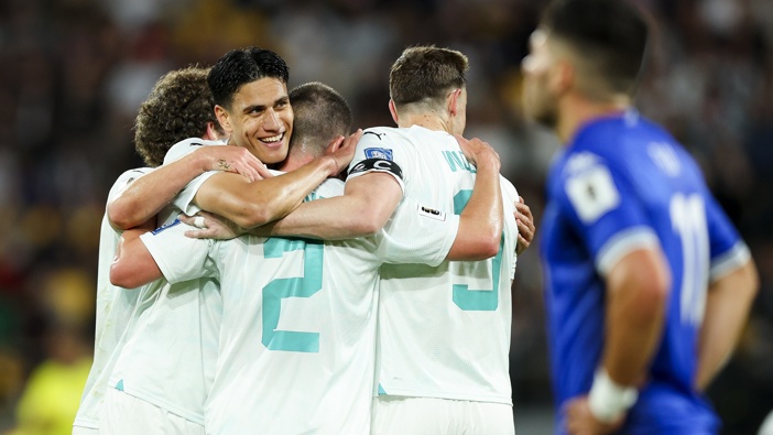 Joe Bell, Marko Stamenić, Tim Payne and Chris Wood of New Zealand celebrate Payne's goal during the FIFA World Cup 2026 OFC Qualifier Semi Final match between New Zealand All Whites and Fiji at Sky Stadium on March 21, 2025 in Wellington, New Zealand. (Photo by Hagen Hopkins/Getty Images)
