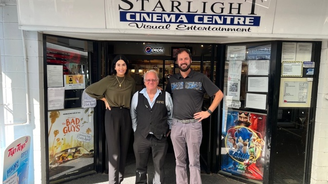 Peter Smith, owner of Starlight Cinema Taupō for 43 years (centre) with new owners Tammy and Charlie Prince.