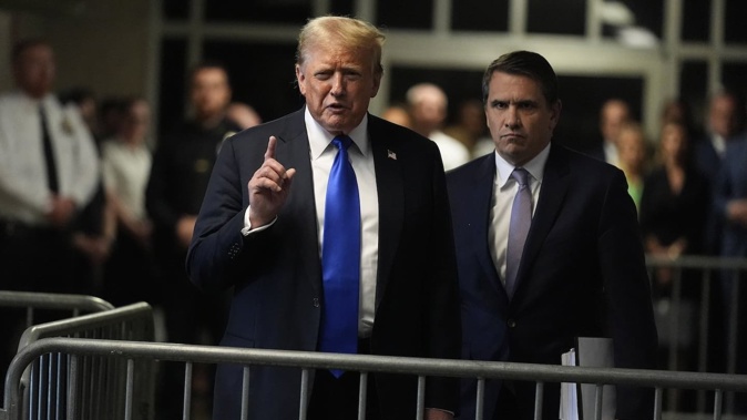 Former President Donald Trump comments to members of the media after being found guilty on 34 felony counts. Photo / AP