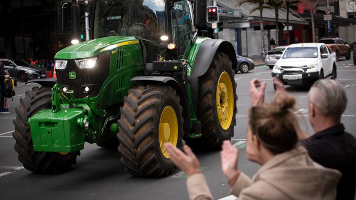 A John Deere tractor rumbles along Queen St in Auckland during the Howl of a Protest event, organised by Groundswell New Zealand. (Photo / Greg Bowker)