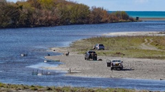 People whitebaiting at the mouth of the Tukituki River in September 2021. Photo / Warren Buckland
