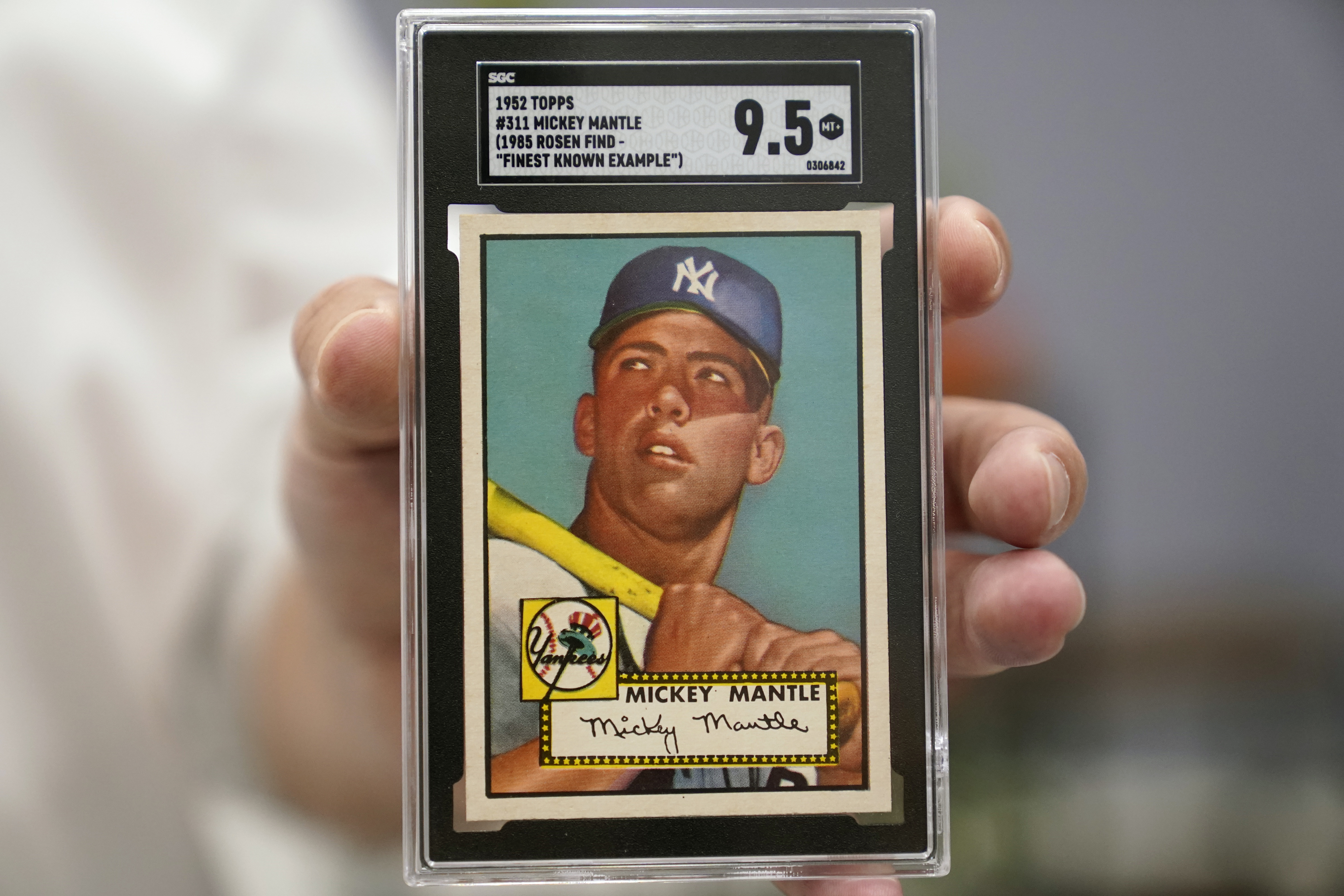 A Mickey Mantle baseball card is displayed at Heritage Auctions in Dallas. The mint-condition Mantle card is expected to sell well into the millions when bidding ends at the end of the month. Photo / AP