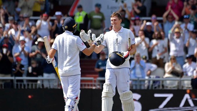 England's Zak Crawley, right, celebrates with batting partner Joe Root after scoring a century during the second day of the fourth Ashes cricket test. Photo / AP