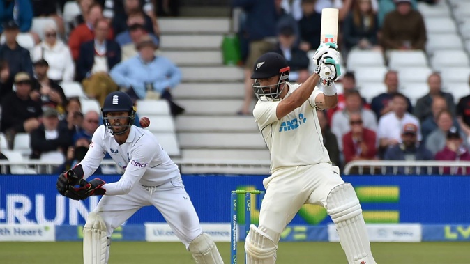 New Zealand's Daryl Mitchell, right, plays a shot during the fourth day of the second test. Photo / AP
