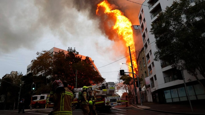 The fire breaks out in a former apartment building in Surry Hills, central Sydney. Photo / Jonathan Ng