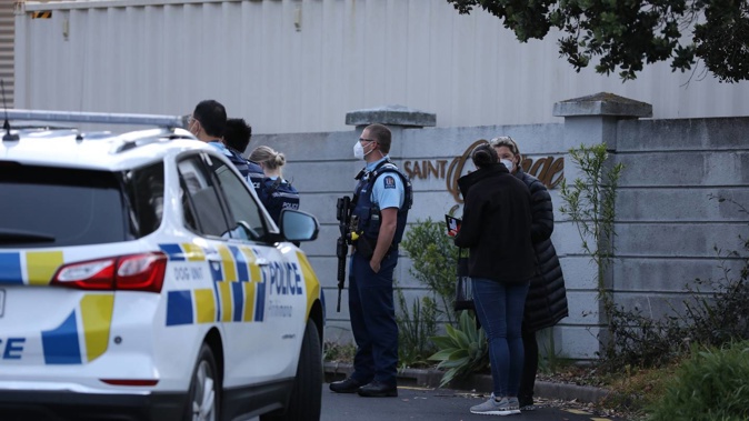 Armed police have called on residents in Saintly Lane to remain in their houses while they look for a person of interest. (Photo / Hayden Woodward)