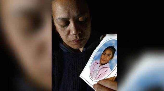 Kathleen Kawana holds a portrait of her daughter Iriaka, who died after being crushed by a tree back in 2005. Photo / Paul Taylor