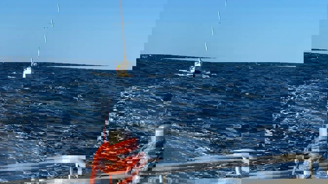 Coastguard Whangārei tows the yacht from north of Great Barrier Island. Photo / Coastguard NZ