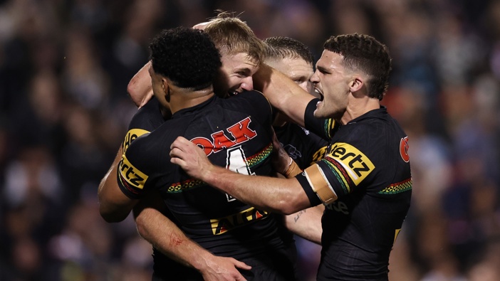 Luke Garner of the Panthers celebrates scoring a try with Paul Alamoti and Nathan Cleary of the Panthers during the NRL Qualifying Final match between Penrith Panthers and Sydney Roosters at BlueBet Stadium on September 13, 2024 in Penrith, Australia. (Photo by Cameron Spencer/Getty Images)