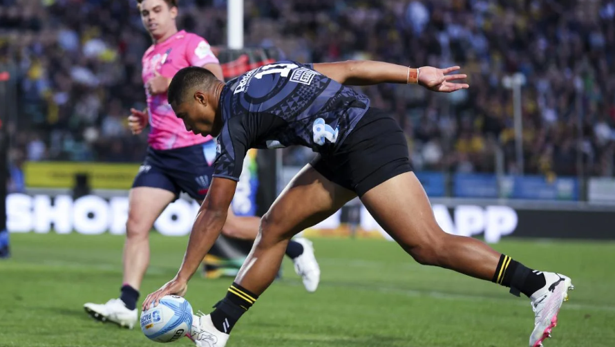 Salesi Rayasi crosses over for the Hurricanes in their win over the Rebels. Photo / Getty