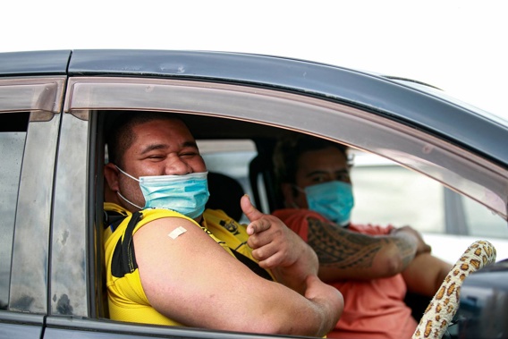 Antonio Taii and Johnny Ramble pictured at a vaccination clinic in Māngere. (Photo / Alex Burton)