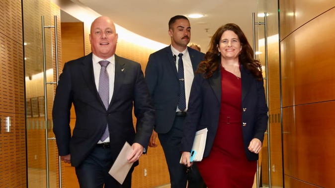 Prime Minister Christopher Luxon and Finance Minister Nicola Willis arriving to speak to media after the OCR announcement. Photo / Mark Mitchell