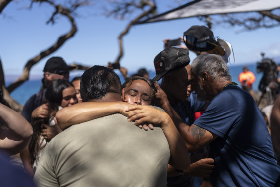 Lahaina, Hawaii, residents, who are affected by a deadly wildfire that devastated the community, hug one another after a news conference in Lahaina, Hawaii, Friday, Aug. 18, 2023. Photo / AP