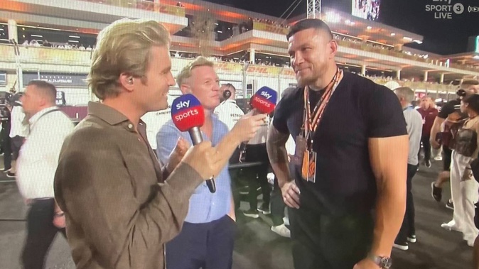 Former All Black Sonny Bill Williams speaks to Sky presenters Nico Rosberg (left) and Simon Lazenby ahead of the F1 race in Qatar. Photo / Sky