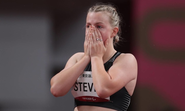 Anna Steven reacts after receiving a disqualification for a false start in the women's 100m T64 heats. (Photo / Getty)