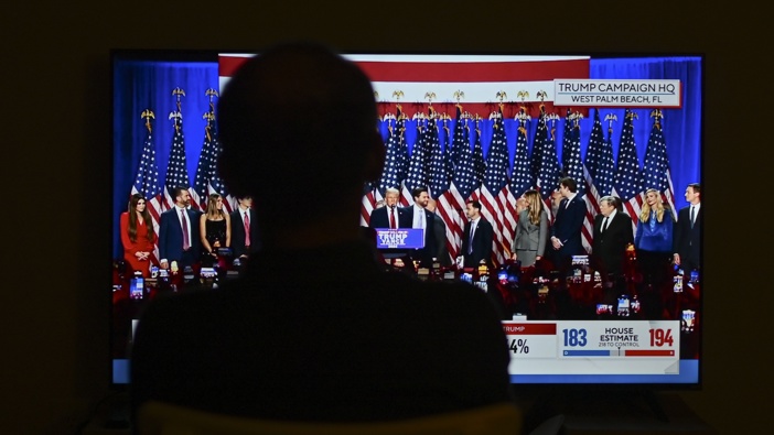 Residents in Virginia watch Donald Trump's speech on TV as the vote counting continued in the election between Democratic Party candidate Kamala Harris and Republican Party candidate Donald Trump on November 06, 2024. (Photo by Celal Gunes/Anadolu via Getty Images)