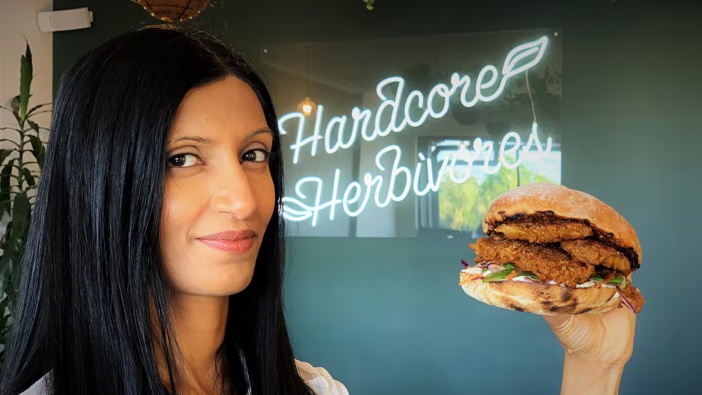 Sunfed Foods co-founder Shama Sukul Lee with a burger featuring the company's chickpea-based "Chicken-Free Chicken", which was sold in 300g packs at the equivalent of $45 per kilo - a price that one of its investors saw on the wrong side of the cost-of-living crisis.