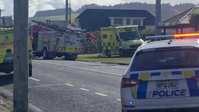 Highcliff Rd in Dunedin has been cordoned off as emergency services attend an apparent house fire. Photo / Craig Baxter